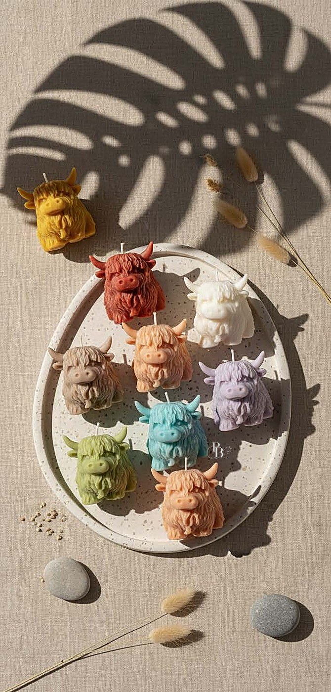 Highland cow head candles arranged on an oval stone tray, handmade soy wax, Pink Blossom bulk order