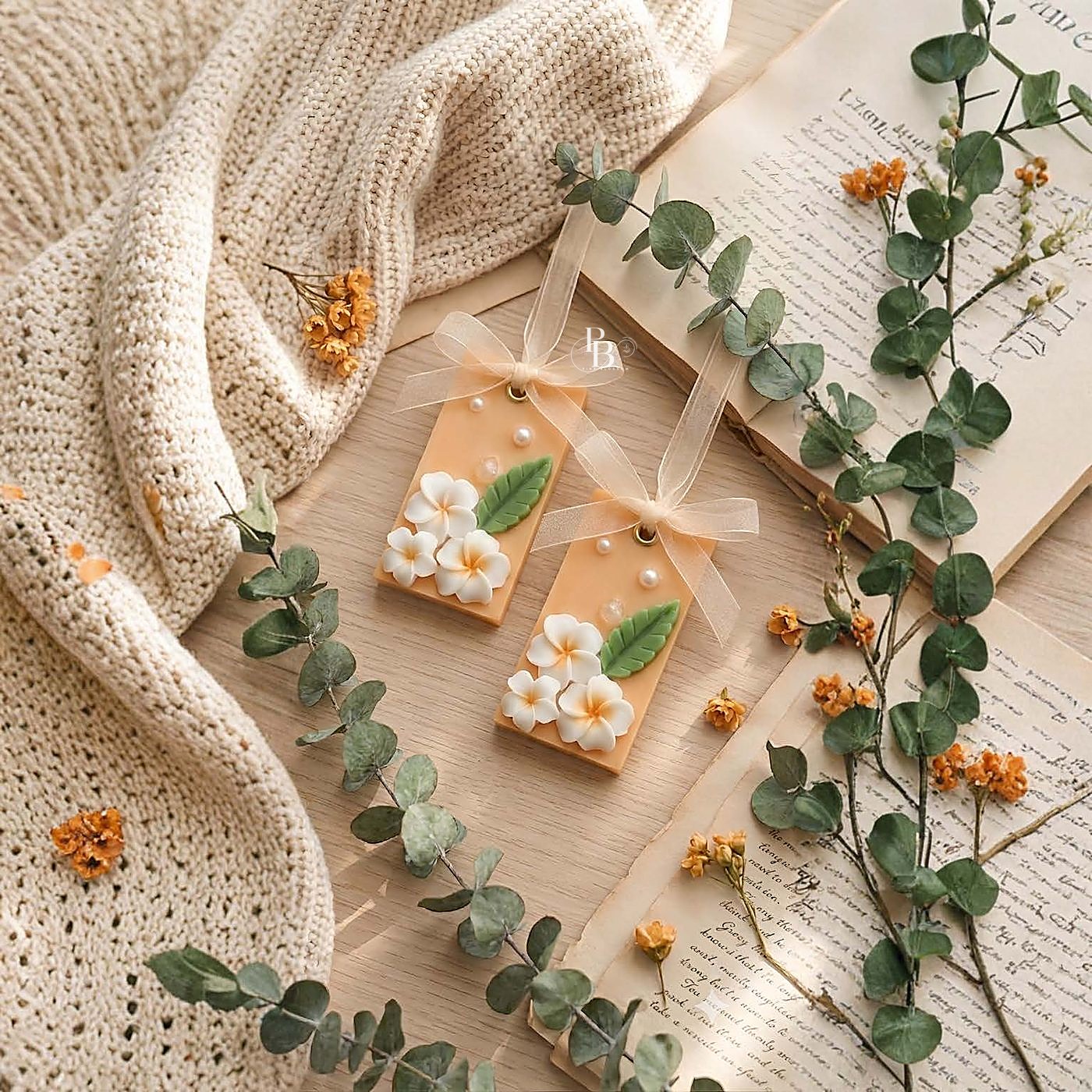 Peach wax sachets topped with white frangipani flowers and a leaf, handmade soy wax, Pink Blossom bulk order