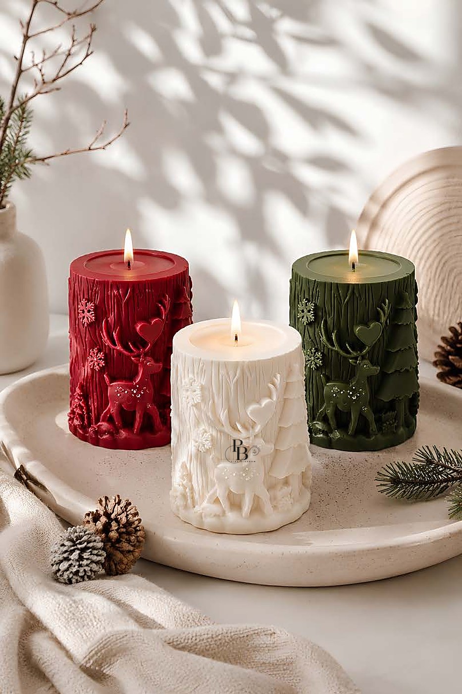 Lit carved reindeer pillar candles on a round tray, handmade soy wax, Pink Blossom bulk order