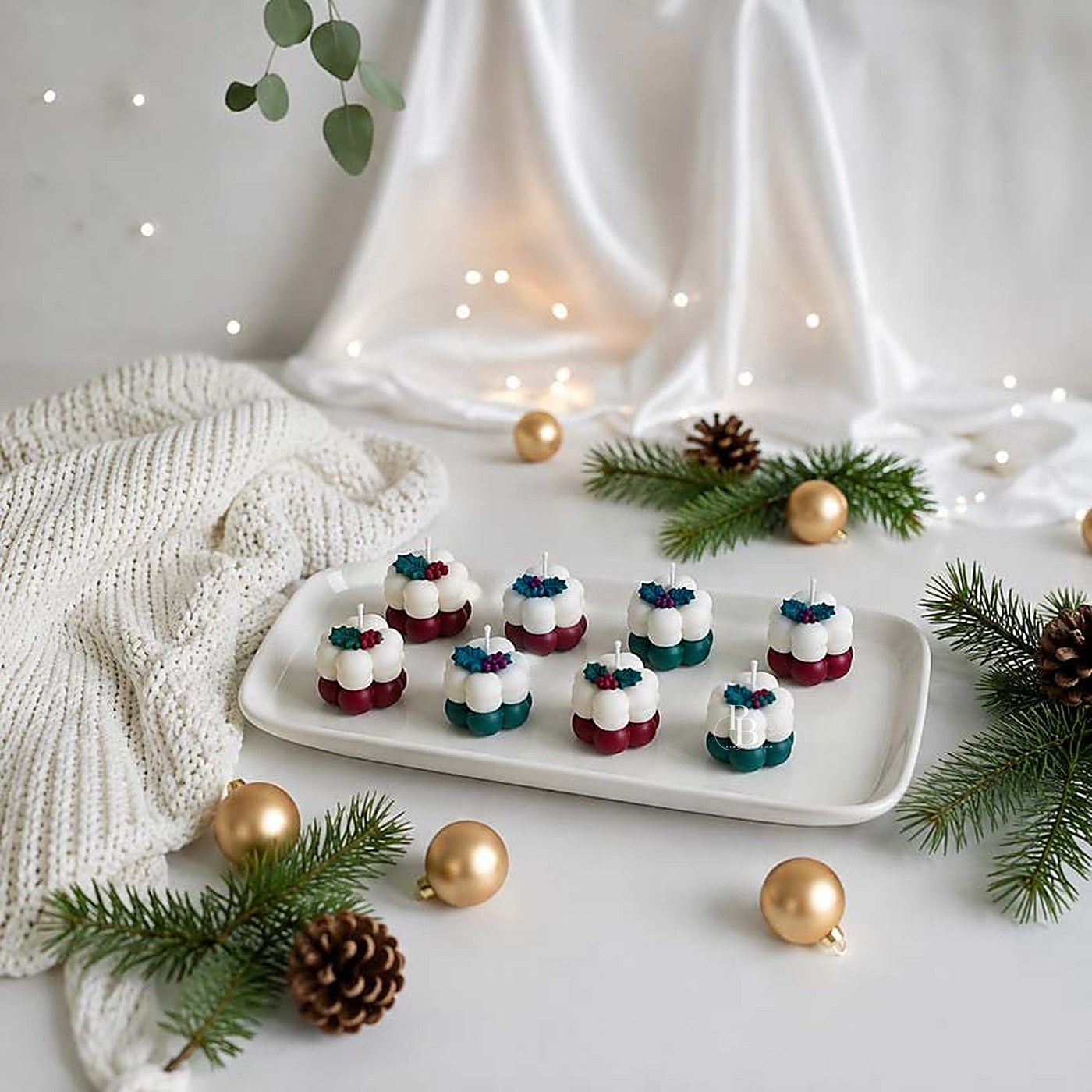 Mini festive pudding candles arranged on a white tray, handmade soy wax, Pink Blossom bulk order
