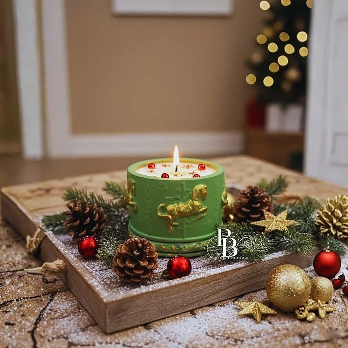 Lit green pillar candle with gold carousel horse, handmade soy wax, Pink Blossom bulk order