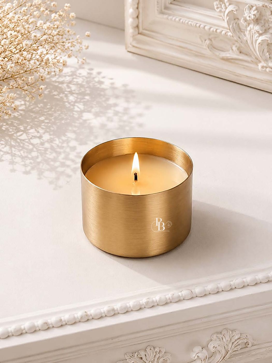 Lit candle in a brushed gold tin on a white table, 3 * 3 Inch Urli, handmade soy wax, Pink Blossom bulk order